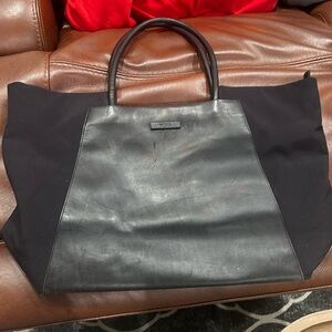 Tumi black leather travel bag